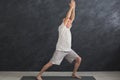 Senior man practicing yoga indoors Royalty Free Stock Photo