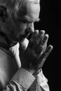 Senior man praying. Royalty Free Stock Photo