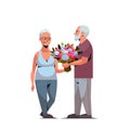 Senior man presenting bouquet of flowers to elderly woman international happy womens day 8 march holiday concept couple