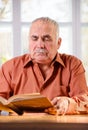 Senior man reading a book