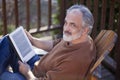 Senior man reading a net book