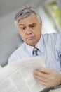 Senior man reading newspaper Royalty Free Stock Photo