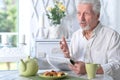 Portrait of an senior man reading newspaper Royalty Free Stock Photo