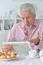 Senior man reading newspaper Royalty Free Stock Photo