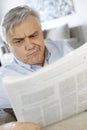 Senior man reading newspaper Royalty Free Stock Photo