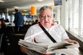 Senior man reading newspaper Royalty Free Stock Photo