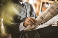 Senior man reading newspaper.