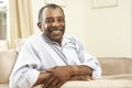 Senior Man Relaxing In Chair At Home Royalty Free Stock Photo