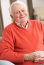 Senior Man Relaxing In Chair At Home Royalty Free Stock Photo