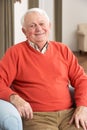 Senior Man Relaxing In Chair At Home Royalty Free Stock Photo