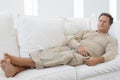 Senior Man Relaxing On Couch Royalty Free Stock Photo