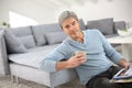 Senior man relaxing at home and drinking coffee Royalty Free Stock Photo