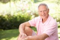 Senior man relaxing in a park Royalty Free Stock Photo