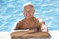 Senior Man Relaxing In Swimming Pool Royalty Free Stock Photo