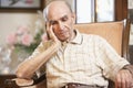 Senior man resting in armchair Royalty Free Stock Photo