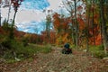 Senior man riding an ATV quad in Autumn Royalty Free Stock Photo