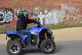 Senior, 67 years old, rides a quad bike Royalty Free Stock Photo