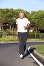Senior Man Running On Road Royalty Free Stock Photo