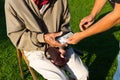 Senior man`s hands holding Euro banknote. Struggling pensioners Royalty Free Stock Photo