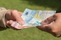 Senior man`s hands holding Euro banknote. Struggling pensioners Royalty Free Stock Photo