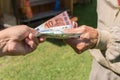 Senior man`s hands holding Euro banknote. Struggling pensioners Royalty Free Stock Photo
