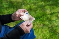 Senior man's hands holding Euro banknote. Struggling pensioners concept. Royalty Free Stock Photo