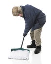 Senior Man Scooping Up Snow Royalty Free Stock Photo