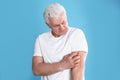 Senior man scratching arm. Allergy symptom Royalty Free Stock Photo