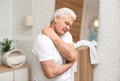 Senior man scratching neck. Allergy symptom Royalty Free Stock Photo