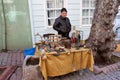 Senior man sells antiques on the flea market