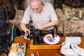 Senior Man Sewing Needle Point Craft with Machine Royalty Free Stock Photo