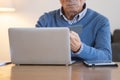 Senior man shopping online using laptop and credit card Royalty Free Stock Photo