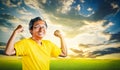 Senior Man showing off muscle for strong healthy lifestye concept with golden nature sky background