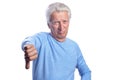 Senior man showing thumbs down on white background Royalty Free Stock Photo