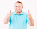 Senior man showing thumbs up over white Royalty Free Stock Photo