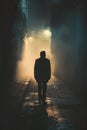 Senior man silhouette walking in a dark urban alley at night. Royalty Free Stock Photo