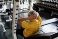 Senior man sit up in gym