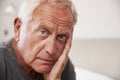 Senior Man Sitting On Bed At Home Suffering From Depression Royalty Free Stock Photo