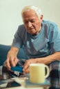 Senior Man Sitting On Bed Taking Medication Royalty Free Stock Photo