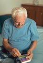Senior Man Sitting On Bed Taking Medication Royalty Free Stock Photo
