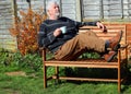 Senior man drinking coffee or tea outdoors. Royalty Free Stock Photo