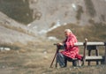 Senior man is sitting on the bench in the mountain Royalty Free Stock Photo