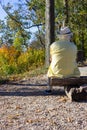 senior man sitting on bench at mountain top fall season Royalty Free Stock Photo