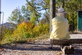 senior man sitting on bench at mountain top fall season Royalty Free Stock Photo