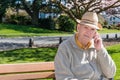 Senior Man Talking on Cell Phone in Park Royalty Free Stock Photo