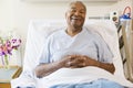 Senior Man Sitting In Hospital Bed Royalty Free Stock Photo