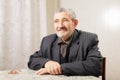 Senior man sitting at table