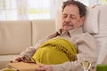 Senior man sleeping in armchair Royalty Free Stock Photo