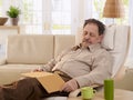 Senior man sleeping in armchair Royalty Free Stock Photo