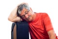 Senior man sleeping on luggage Royalty Free Stock Photo